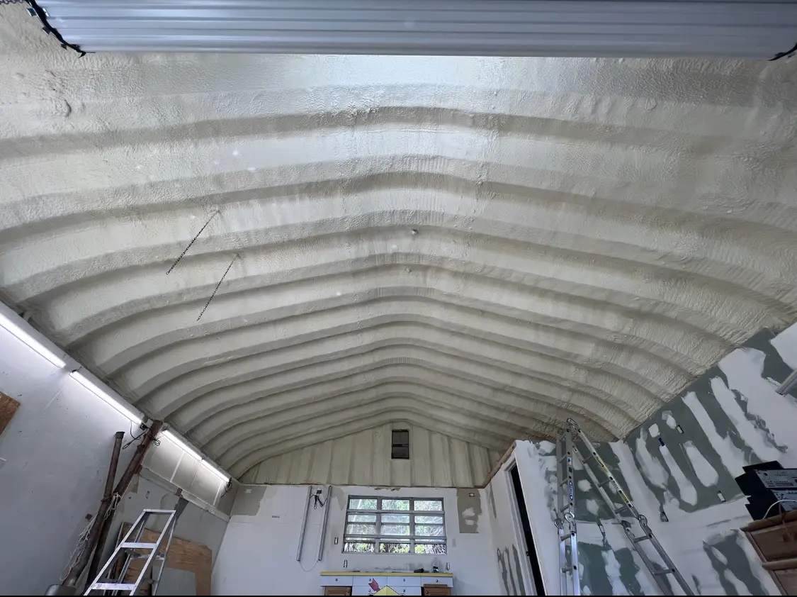 Spray polyurethane foam applied to the underside of a metal roof deck in Steelton
